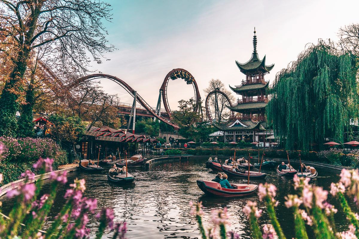 Tivoli Gardens amusement park in Copenhagen is a must for all visitors to the city, young and old. Tivoli is located just a few minutes walk from City Hall, and with the Copenhagen Central Station as its nearest neighbour it is very easy to get to.

Tivoli Gardens was founded in 1843 and has become a national treasure and an international attraction. Fairy tale writer Hans Christian Andersen visited many times, as did Walt Disney and many other celebrities, who all fell in love with the gardens.

Part of Tivoli Gardens' secret is that there is something for everyone. The scenery is beautiful with exotic architecture, historic buildings and lush gardens. At night, thousands of coloured lights create a fairy tale atmosphere that is completely unique.